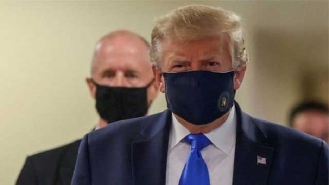 Trump finally wears mask in public