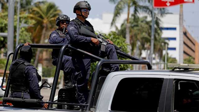 13 police killed by suspected cartel gunmen in west Mexico