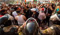 Iraq's PM calls for talks as thousands of protesters defy curfew