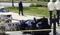US Capitol lockdown: two officers injured after car rams into barrier
