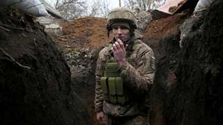 Russia says withdrawing military forces near Ukraine border