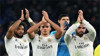 Real Madrid go through top