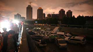 Record rains in China kill 33
