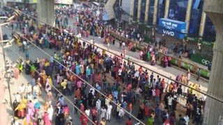 Garments workers take to streets in Mirpur demanding pay hike, arrears