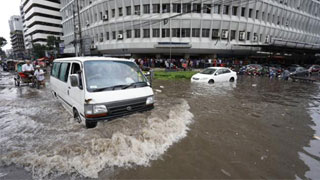 Commuters suffer as city roads go under rainwater
