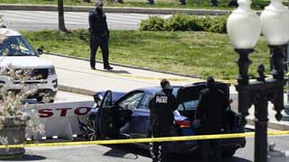 US Capitol lockdown: two officers injured after car rams into barrier