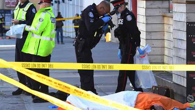 Driver kills 10 plowing van into Toronto sidewalk crowd