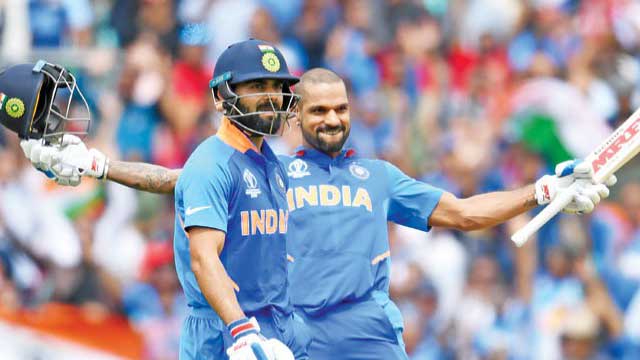 Dhawan ton helps India down Australia
