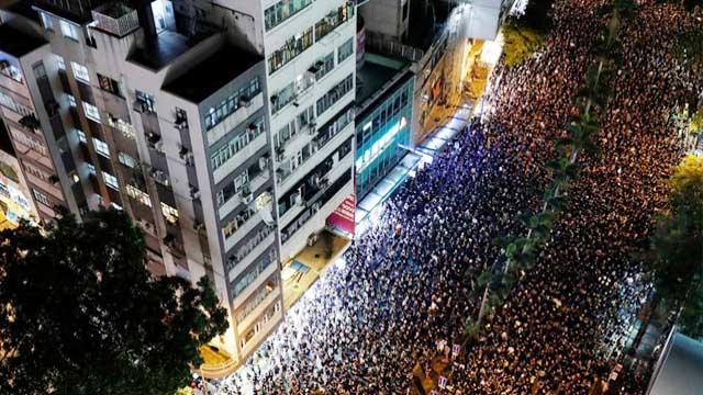 Hong Kong leader apologises as massive rally chokes city
