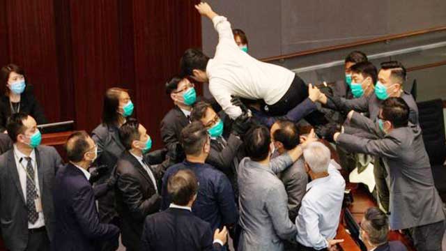 Hong Kong: Lawmakers carried out during parliament mayhem